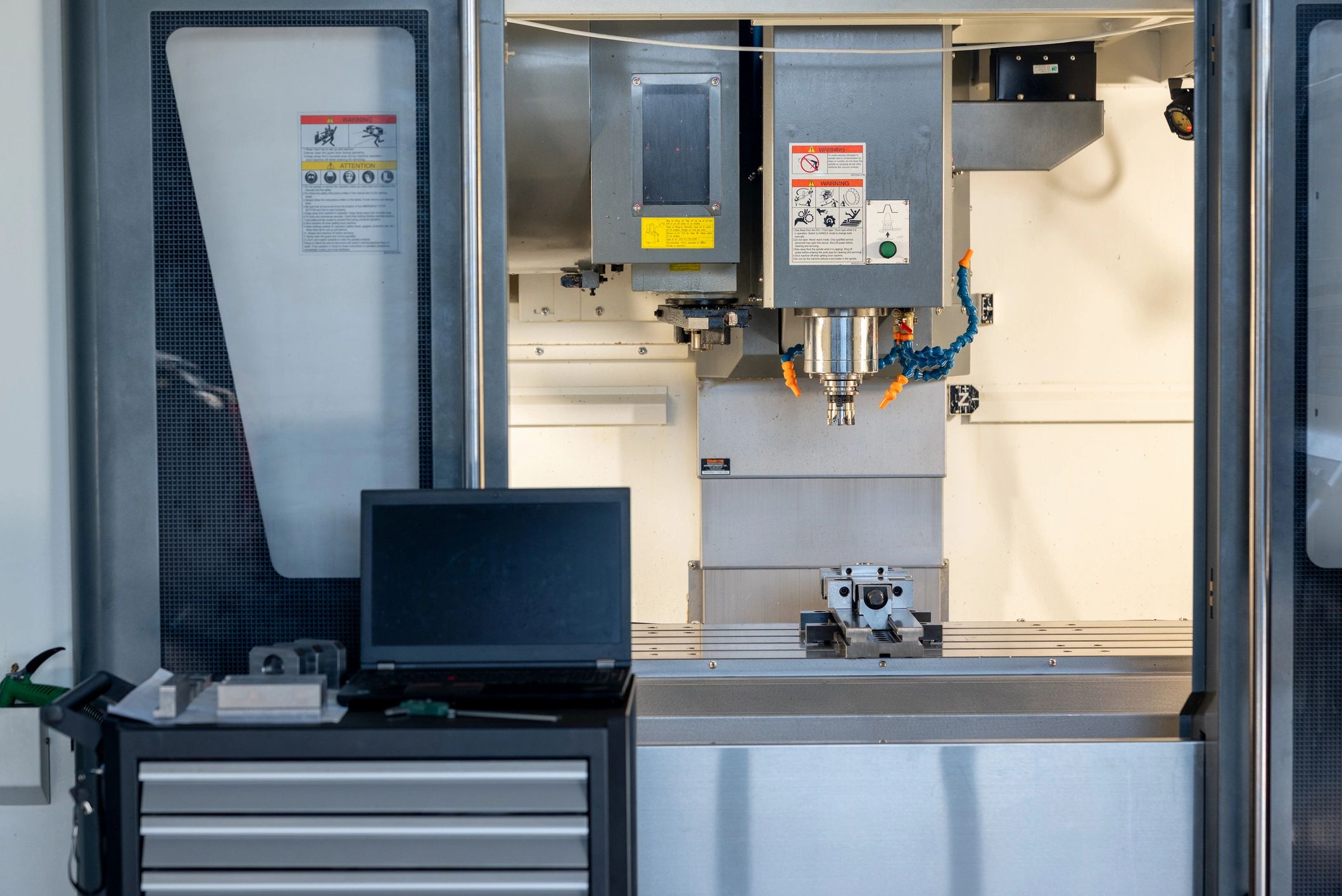 Close-up of a metal workpiece inside a professional CNC machine